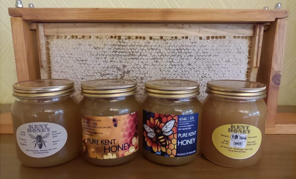4 jars and a frame of honey